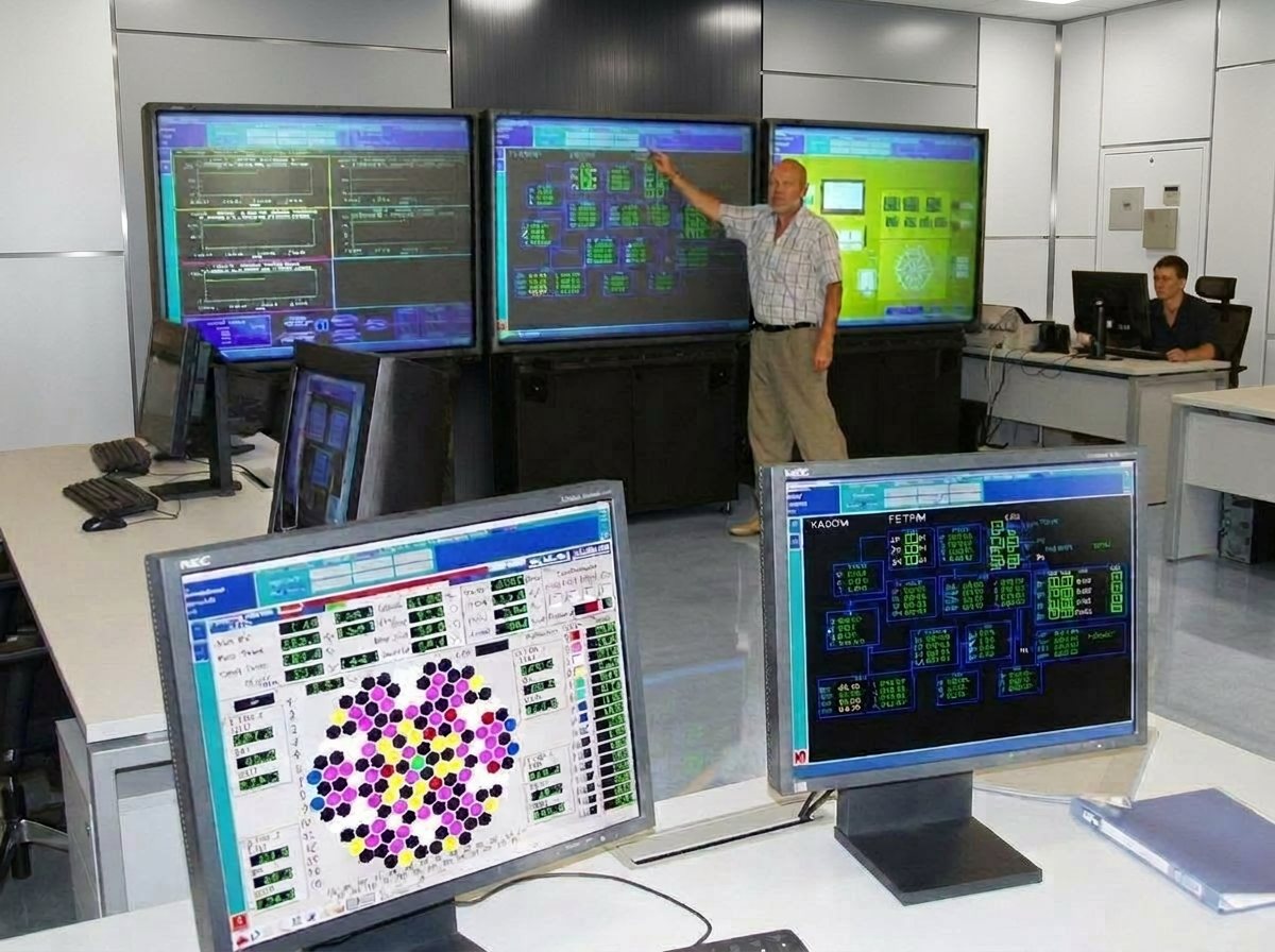 Reactor control room with monitoring screens.